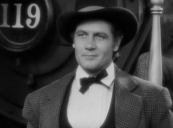 Movie still from “Union Pacific” (1939), directed by Cecil B. DeMille – A black and white photo of a man wearing a hat; Close Up shot, Low angle