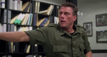 Movie still from “Universal Soldier: The Return” (1999), directed by Mic Rodgers – A person in a room; Close Up shot, Over the shoulder angle