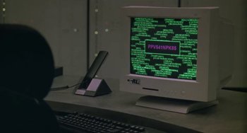 Movie still from “Universal Soldier: The Return” (1999), directed by Mic Rodgers – A computer monitor sitting on top of a desk; Extreme Close Up shot, High angle