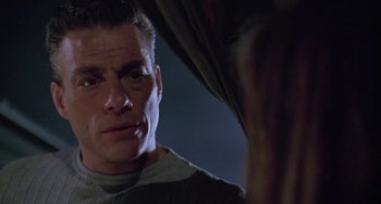 Movie still from “Universal Soldier: The Return” (1999), directed by Mic Rodgers – A person looking at a person; Close Up shot, Low angle