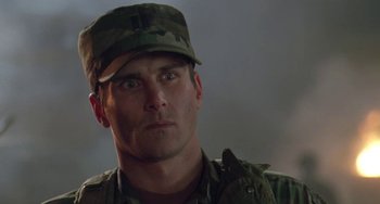 Movie still from “Universal Soldier: The Return” (1999), directed by Mic Rodgers – A person wearing a hat; Close Up shot, Low angle