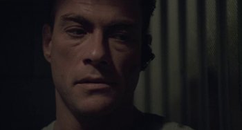 Movie still from “Universal Soldier: The Return” (1999), directed by Mic Rodgers – A person wearing a headset; Close Up shot, High angle