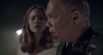 Movie still from “Universal Soldier: The Return” (1999), directed by Mic Rodgers – A man and a woman are looking at each other; Close Up shot, Low angle