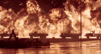 Movie still from “Universal Soldier: The Return” (1999), directed by Mic Rodgers – An image of an oil rig fire in the water; Extreme Wide shot, Low angle