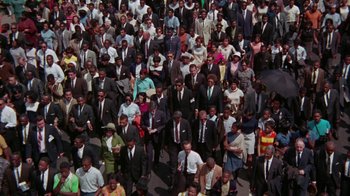 Movie still from “Uptight” (1968), directed by Jules Dassin – An overhead view of a crowd of people wearing suits and ties; Extreme Wide shot, High angle