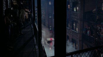 Movie still from “Uptight” (1968), directed by Jules Dassin – A view of a city street from a window at night; Extreme Wide shot, High angle