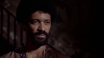 Movie still from “Uptight” (1968), directed by Jules Dassin – A person with a beard; Close Up shot, Low angle