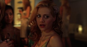 Movie still from “Uptown Girls” (2003), directed by Boaz Yakin – A beautiful young woman with long red hair and green eyes; Close Up shot, Over the shoulder angle