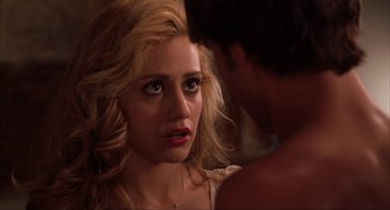 Movie still from “Uptown Girls” (2003), directed by Boaz Yakin – A young woman looking at a young man in front of a mirror; Close Up shot, Over the shoulder angle