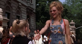 Movie still from “Uptown Girls” (2003), directed by Boaz Yakin – A woman is shaking hands with another woman outside; Medium shot, Over the shoulder angle