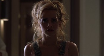 Movie still from “Uptown Girls” (2003), directed by Boaz Yakin – A beautiful young woman with blonde hair wearing a tank top; Close Up shot, Low angle