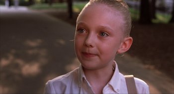 Movie still from “Uptown Girls” (2003), directed by Boaz Yakin – A young girl in a white shirt is looking at the camera; Close Up shot, Over the shoulder angle
