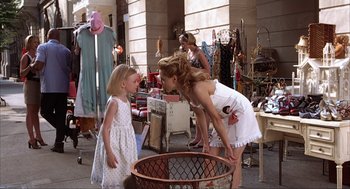 Movie still from “Uptown Girls” (2003), directed by Boaz Yakin – A woman and a little girl standing next to a basket; Medium shot, Over the shoulder angle