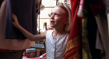 Movie still from “Uptown Girls” (2003), directed by Boaz Yakin – A little girl standing in front of a window looking up; Close Up shot, Over the shoulder angle