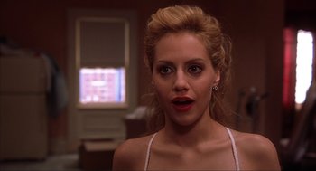 Movie still from “Uptown Girls” (2003), directed by Boaz Yakin – A person wearing a white shirt; Close Up shot, Over the shoulder angle