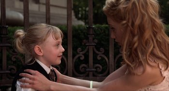 Movie still from “Uptown Girls” (2003), directed by Boaz Yakin – A woman and a young girl touching each other's shoulders; Medium shot, Over the shoulder angle