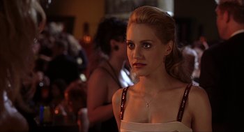Movie still from “Uptown Girls” (2003), directed by Boaz Yakin – A beautiful young lady wearing a white dress; Close Up shot, Over the shoulder angle