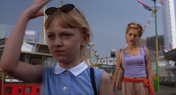 Movie still from “Uptown Girls” (2003), directed by Boaz Yakin – A young girl is standing in front of a woman; Medium shot, Low angle
