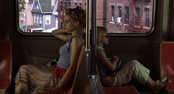 Movie still from “Uptown Girls” (2003), directed by Boaz Yakin – A woman and a boy sitting on a bus; Medium shot, Over the shoulder angle