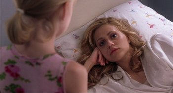Movie still from “Uptown Girls” (2003), directed by Boaz Yakin – A young woman lying in a bed with her hand on her face; Close Up shot, Over the shoulder angle