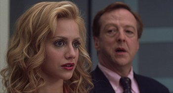 Movie still from “Uptown Girls” (2003), directed by Boaz Yakin – A man and a woman are looking at the camera; Close Up shot, Over the shoulder angle