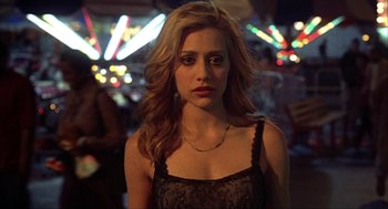 Movie still from “Uptown Girls” (2003), directed by Boaz Yakin – A woman in a black top is looking at the camera; Close Up shot, High angle
