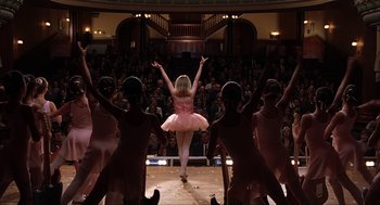 Movie still from “Uptown Girls” (2003), directed by Boaz Yakin – A girl in a pink tutu is performing a dance; Wide shot, Low angle