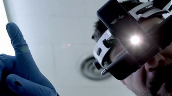 Movie still from “V/H/S/2” (2013), directed by Timo Tjahjanto – A person holding a cell phone up to their head; Extreme Close Up shot, Low angle