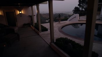 Movie still from “V/H/S/2” (2013), directed by Timo Tjahjanto – A view of a swimming pool from the patio of a house; Extreme Wide shot, High angle