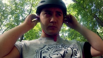 Movie still from “V/H/S/2” (2013), directed by Timo Tjahjanto – A man wearing a helmet while standing in the woods; Close Up shot, Low angle