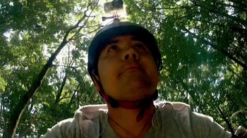 Movie still from “V/H/S/2” (2013), directed by Timo Tjahjanto – A man wearing a helmet and holding a camera up to his head; Extreme Close Up shot, Overhead angle