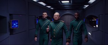 Movie still from “Valerian and the City of a Thousand Planets” (2017), directed by Luc Besson – A group of men in green and gold uniforms; Medium shot, Low angle