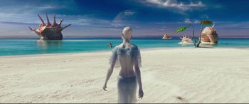 Movie still from “Valerian and the City of a Thousand Planets” (2017), directed by Luc Besson – A woman in a dress walking on the beach; Wide shot, High angle
