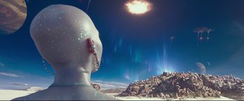 Movie still from “Valerian and the City of a Thousand Planets” (2017), directed by Luc Besson – An image of an alien looking at the sky; Extreme Wide shot, Over the shoulder angle