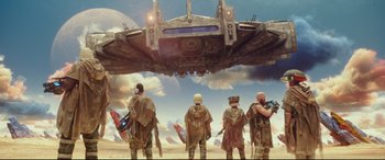 Movie still from “Valerian and the City of a Thousand Planets” (2017), directed by Luc Besson – A group of men standing in front of an airplane; Extreme Wide shot, Low angle