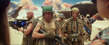 Movie still from “Valerian and the City of a Thousand Planets” (2017), directed by Luc Besson – A group of men standing next to each other holding guns; Medium shot, Low angle