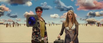Movie still from “Valerian and the City of a Thousand Planets” (2017), directed by Luc Besson – A man and a woman standing next to each other in front of a beach; Medium shot, Low angle