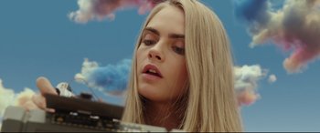 Movie still from “Valerian and the City of a Thousand Planets” (2017), directed by Luc Besson – A person with long hair; Close Up shot, Overhead angle