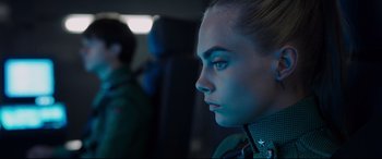 Movie still from “Valerian and the City of a Thousand Planets” (2017), directed by Luc Besson – A person with blue eyes; Close Up shot, Over the shoulder angle