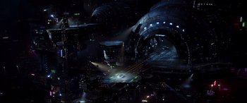 Movie still from “Valerian and the City of a Thousand Planets” (2017), directed by Luc Besson – An aerial view of a city at night with lights; Extreme Wide shot, High angle