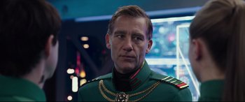 Movie still from “Valerian and the City of a Thousand Planets” (2017), directed by Luc Besson – A person wearing a green uniform; Close Up shot, Over the shoulder angle