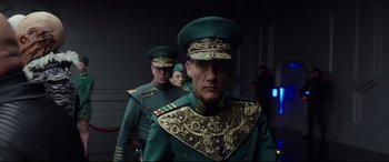 Movie still from “Valerian and the City of a Thousand Planets” (2017), directed by Luc Besson – A group of men in military uniforms walking together; Medium shot, Low angle
