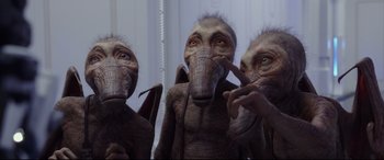 Movie still from “Valerian and the City of a Thousand Planets” (2017), directed by Luc Besson – A group of people that are standing in a room together; Medium shot, High angle