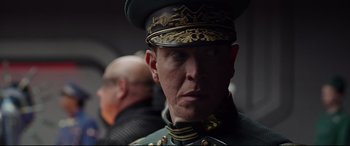 Movie still from “Valerian and the City of a Thousand Planets” (2017), directed by Luc Besson – A person wearing a military uniform; Close Up shot, Over the shoulder angle