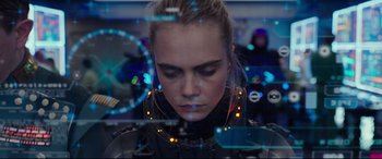 Movie still from “Valerian and the City of a Thousand Planets” (2017), directed by Luc Besson – A person wearing a costume; Close Up shot, Over the shoulder angle
