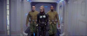 Movie still from “Valerian and the City of a Thousand Planets” (2017), directed by Luc Besson – A group of men in uniform standing next to a woman; Medium shot, Low angle