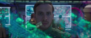 Movie still from “Valerian and the City of a Thousand Planets” (2017), directed by Luc Besson – A young man is looking into the camera; Close Up shot, Over the shoulder angle