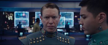 Movie still from “Valerian and the City of a Thousand Planets” (2017), directed by Luc Besson – A person wearing a uniform; Close Up shot, Over the shoulder angle