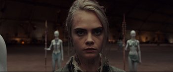 Movie still from “Valerian and the City of a Thousand Planets” (2017), directed by Luc Besson – A person wearing a shirt; Close Up shot, Over the shoulder angle