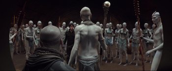 Movie still from “Valerian and the City of a Thousand Planets” (2017), directed by Luc Besson – A group of people standing in a room; Wide shot, High angle